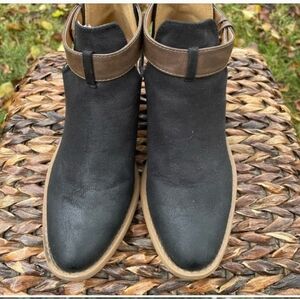 Cute Black cutout ankle boots w/ Brown ankle strap. Like new. Only wore once.